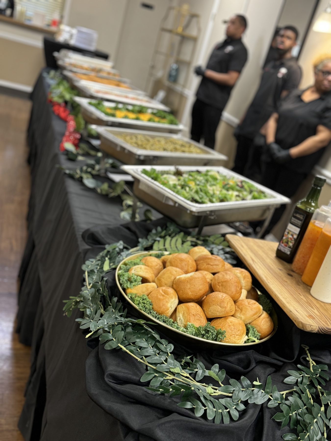 Paynter's Platters buffet table with trays of sides and salads