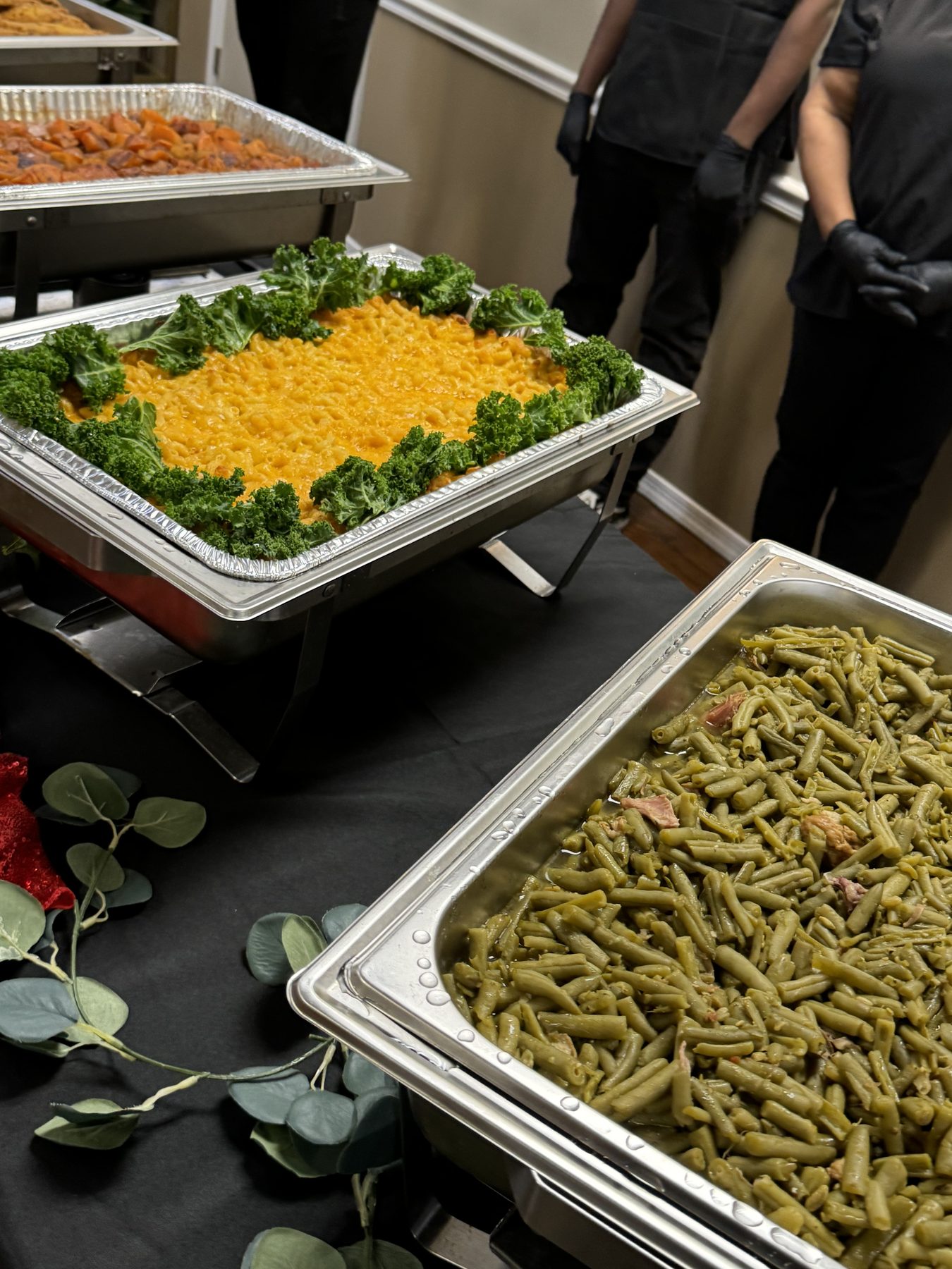 Catering trays of baked macaroni and green beans