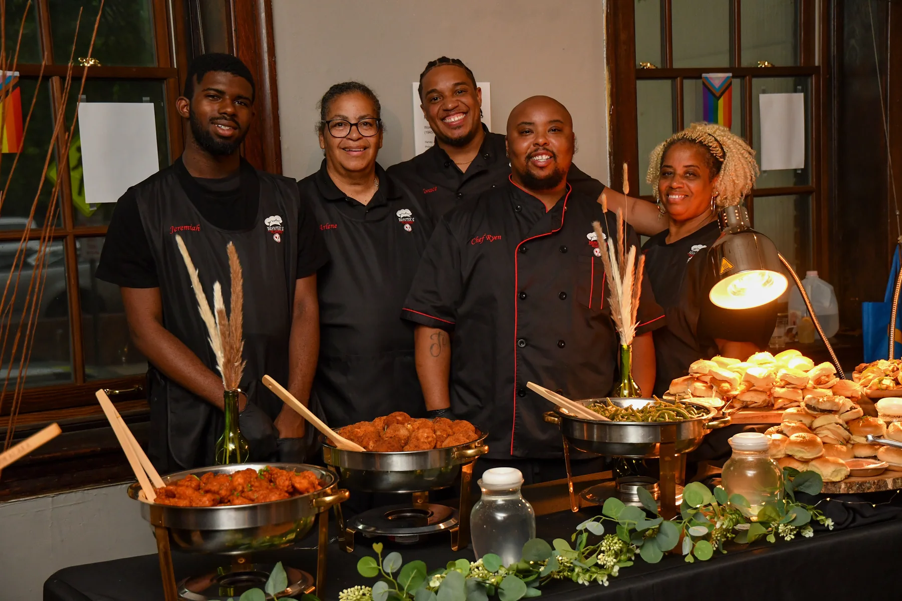 The Paynter's Platters team serving a community event buffet
