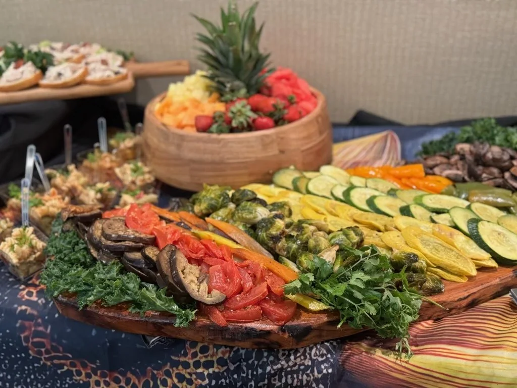 An abundant wedding grazing display with fruit, vegetables, and composed appetizers